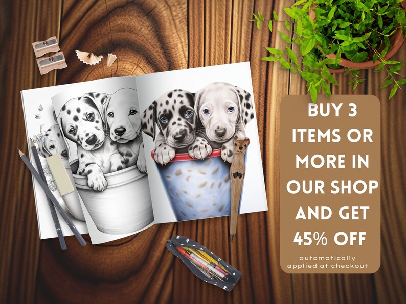 May include: A coloring book open to a page with a black and white illustration of three dalmatian puppies in a bucket. The text on the page reads "BUY 3 ITEMS OR MORE IN OUR SHOP AND GET 45% OFF automatically applied at checkout".