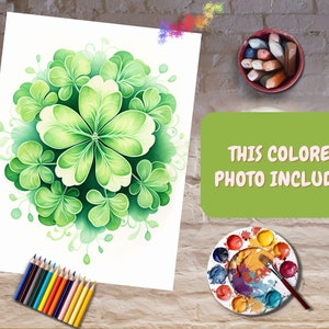 May include: A watercolor painting of a green floral design with a central flower and surrounding leaves. The artwork is on white paper, with the text "THIS COLORED PHOTO INCLUDED" on a green background. Colored pencils and a paint palette are also visible.
