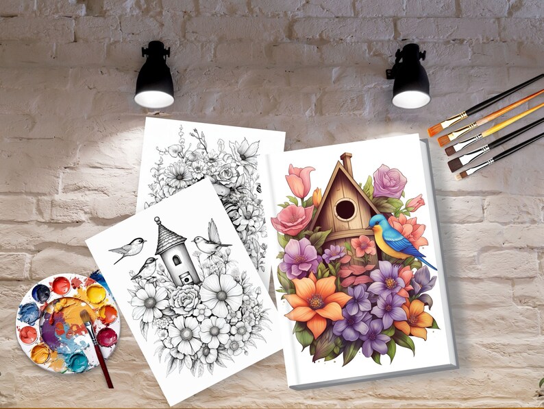May include: Three blank canvases with a birdhouse and flowers drawn in black and white and one canvas with a birdhouse and flowers painted in color. The canvases are on a wooden surface with a paint palette and brushes.