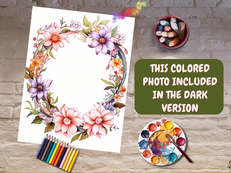 May include: A floral wreath illustration with peach, purple, and yellow flowers. The artwork is on white paper, with a set of colored pencils and a palette of paints nearby. Text on the image reads: "THIS COLORED PHOTO INCLUDED IN THE DARK VERSION."
