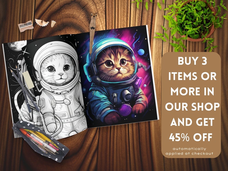 May include: A coloring book open on a wooden surface, showing a cat astronaut illustration. One page is a black and white outline, the other is coloured. Text on the right says "BUY 3 ITEMS OR MORE IN OUR SHOP AND GET 45% OFF".
