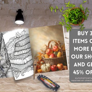 May include: A coloring book with a black and white illustration of a stack of blankets and a basket of apples, pumpkins, and corn. The text on the image reads "BUY 3 ITEMS OR MORE IN OUR SHOP AND GET 45% OFF automatically applied at checkout."