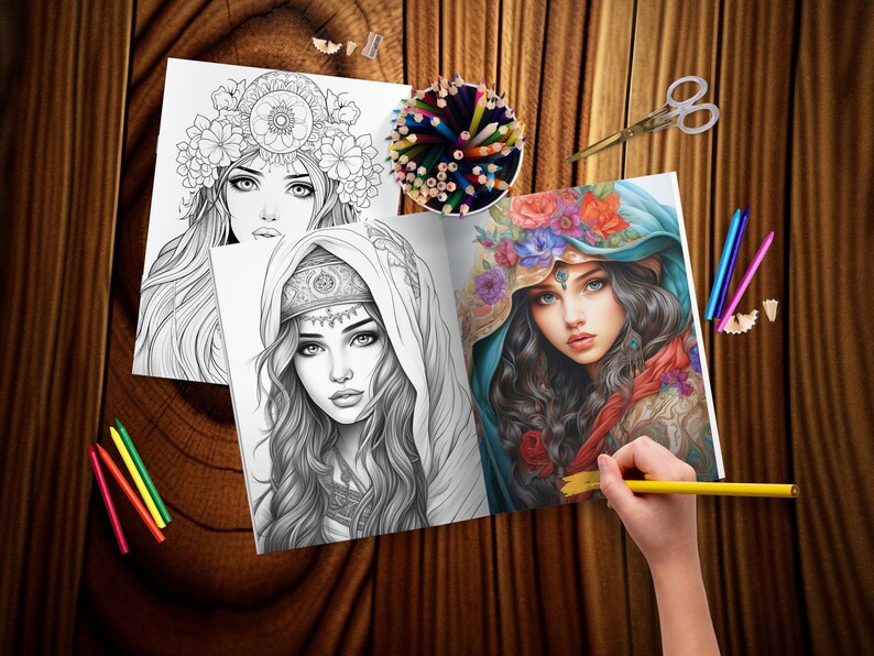 May include: An open coloring book with two black and white illustrations of women with elaborate headwear. The book is open to a page with a woman wearing a blue headscarf and a floral crown. A hand is holding a yellow pencil over the page.