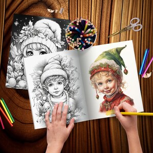 May include: An open colouring book with two illustrations of elves. The elf on the left is wearing a green hat and a red and white outfit. The elf on the right is wearing a blue hat and a brown and white outfit. The book is open on a wooden table with coloured pencils and a pencil sharpener.