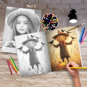 May include: A coloring book open to a page with a black and white illustration of a scarecrow with crows. The scarecrow is wearing a hat and has a long, flowing beard. The page is surrounded by a variety of colored pencils and a small lamp.