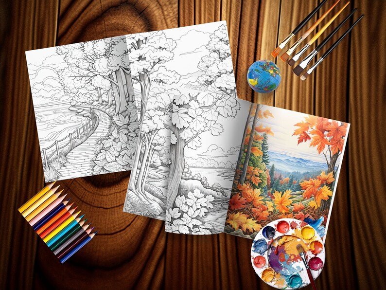 May include: A coloring book with a black and white illustration of a path through a forest and a lake. The book is open to a page with a colored illustration of a forest scene with fall foliage. The book is on a wooden table with paintbrushes, a paint palette, and colored pencils.