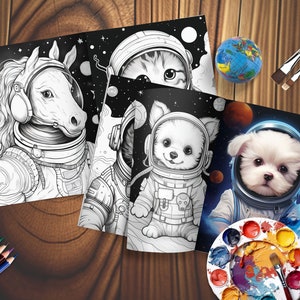 May include: A set of colouring pages depicting animals in space suits, set against a starry backdrop. The pages show a horse, a cat, and two dogs. A globe, paint palette, paintbrushes, and coloured pencils are also present.