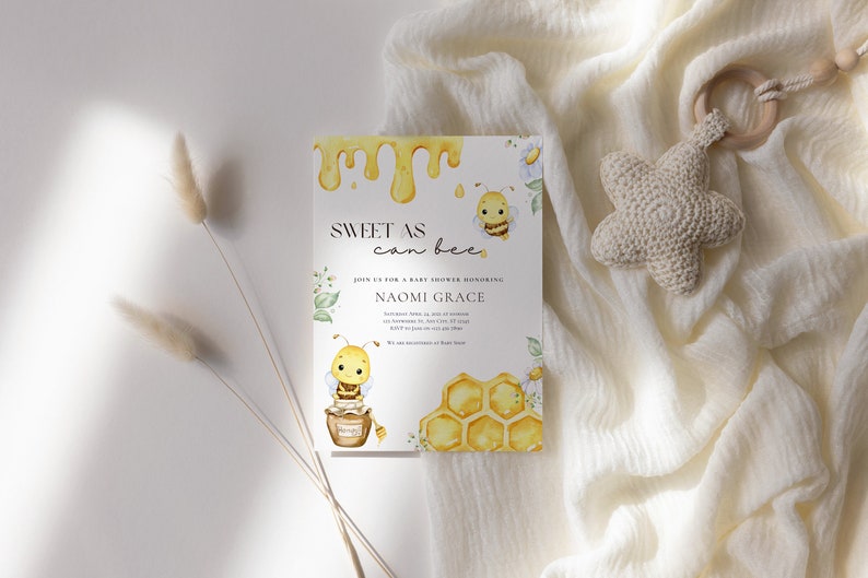 May include: A baby shower invitation with a watercolor illustration of a bee and honeycomb. The invitation reads "Sweet as can bee" and includes the name "Naomi Grace".