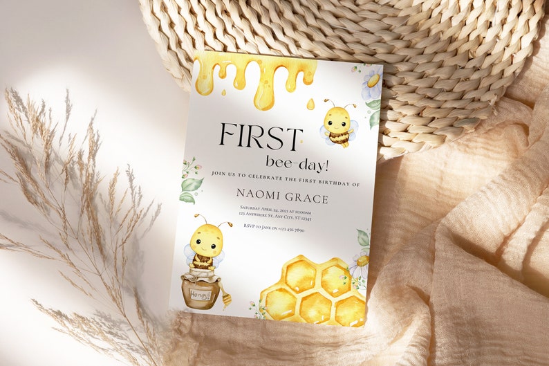 May include: A yellow and white bee-themed first birthday party invitation with a dripping honey design, two cartoon bees, a honeycomb, and the text "FIRST bee-day!" and "JOIN US TO CELEBRATE THE FIRST BIRTHDAY OF NAOMI GRACE".
