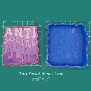 May include: A blue silicone mold for resin casting. The mold is shaped like a rectangle and has the words "Anti Social Moms Club" in raised letters. The mold measures 3.75 inches by 4 inches.