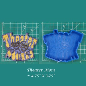 May include: A blue silicone mold for baking a cake or cookie in the shape of the words "Theater Mom" with two theater masks. The mold is approximately 4.75 inches by 3.75 inches.