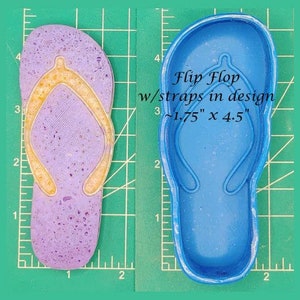 May include: A blue silicone mold for making flip flops with straps. The mold is 1.75 inches by 4.5 inches.