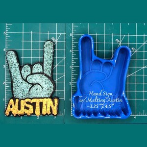 May include: Two hand sign designs. One is a finished product with a turquoise and black color scheme and the word "AUSTIN" in gold. The other is a blue mold with the text "Hand Sign w/ Melting Austin ~8.3 x 11.4 cm".
