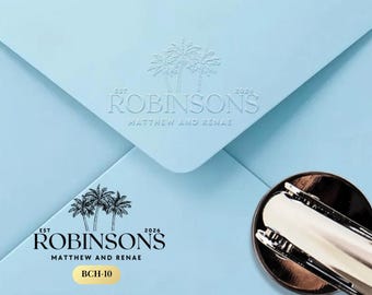 May include: Light blue envelope with embossed palm trees and the text "ROBINSONS MATTHEW AND RENAE". A metal paper clip is in the lower right corner. The text "BCH-10" is also visible.