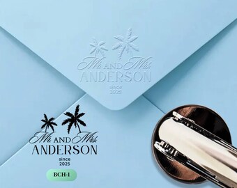May include: A light blue envelope with embossed text reading "Mr. and Mrs. ANDERSON since 2025" and a matching printed design. A bronze and silver stamp is in the lower right corner. The text "BCH-1" is printed on the envelope.