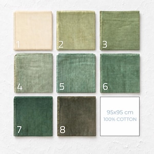 May include: A grid of eight square cotton fabric swatches in various shades of green and cream, numbered one through eight. Each swatch displays a distinct colour gradient. A white square includes the text 95x95 cm 100% COTTON in blue.