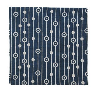 May include: A blue cotton napkin with a white geometric pattern of circles and lines.
