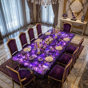 May include: A luxurious dining table with a vibrant purple agate top, surrounded by ten velvet chairs with gold trim. The table is set with fine china and candles, under a crystal chandelier. The room features ornate decor.