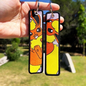 BUY 2 GET 3 - Dubbelzijdig geborduurde anime-sleutelhanger / sleutelhangers / Jet Tag