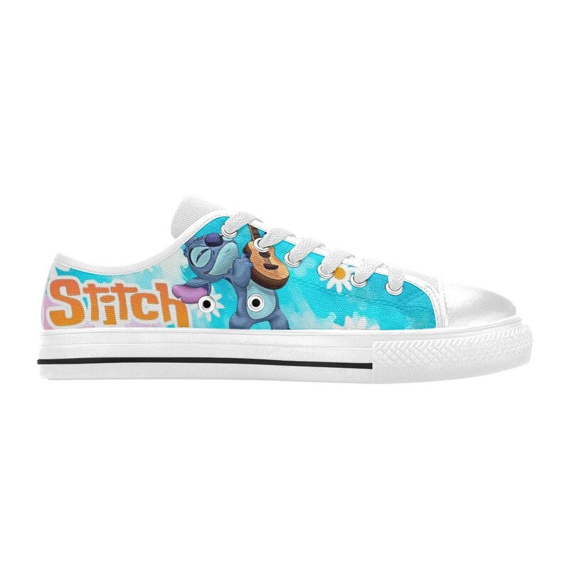 May include: White canvas low-top sneakers with a blue and white design featuring Stitch from Lilo & Stitch playing a guitar. The word "Stitch" is printed in orange on the side of the shoe.