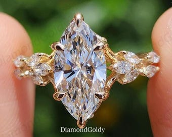 Bague de fiançailles vintage en or 14 carats avec moissanite taille marquise, inspirée par la nature et sertie de diamants. Bague de promesse pour femme.