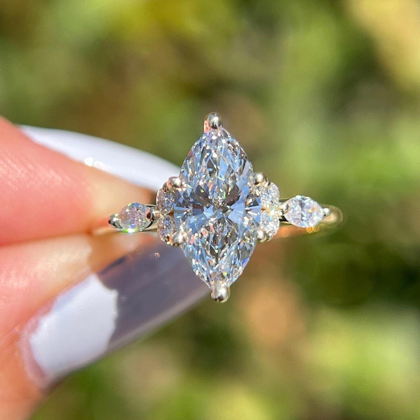 Marquise cluster ring store