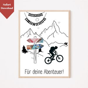 May include: A black and white illustration of a mountain range with a signpost pointing in two directions. The signpost is decorated with colorful paper money. A silhouette of a person riding a bicycle is in the foreground. The text "Happy Birthday" is written in a banner above the mountains. The text "F&uuml;r deine Abenteuer!" is written below the bicycle.