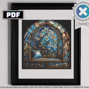 May include: A stained glass window featuring a blue and gold floral design. The window is framed in a dark wood frame.