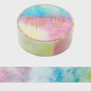 May include: A roll of masking tape featuring a watercolor-style gradient of blue, yellow, and pink hues. The top label displays the text Masking tape and the smaller text TSUTSUMU COMPANY LTD in gold foil lettering against the colorful background.