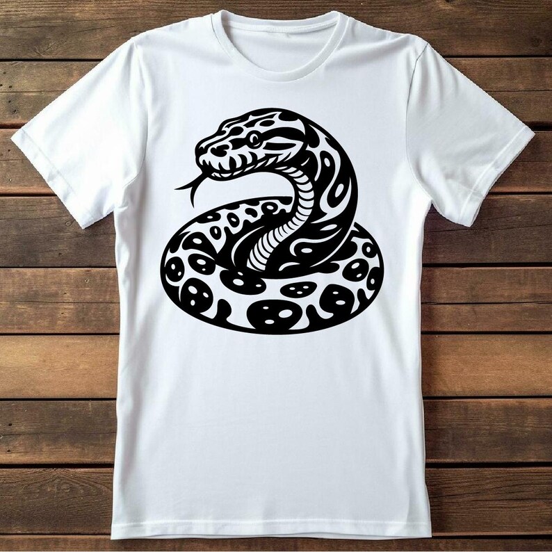 May include: White t-shirt with a black and white graphic of a snake coiled up.