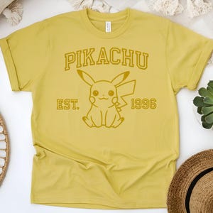 Anime embroidered t-shirts Pikachu, Outline design  on the t-shirt. Mint = adult green, lime = youth green. silver=sport grey.