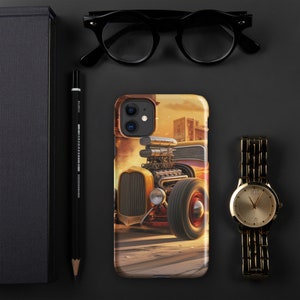 May include: A yellow and red vintage hot rod car with a large engine and chrome details. The car is driving on a dusty road with a city skyline in the background.