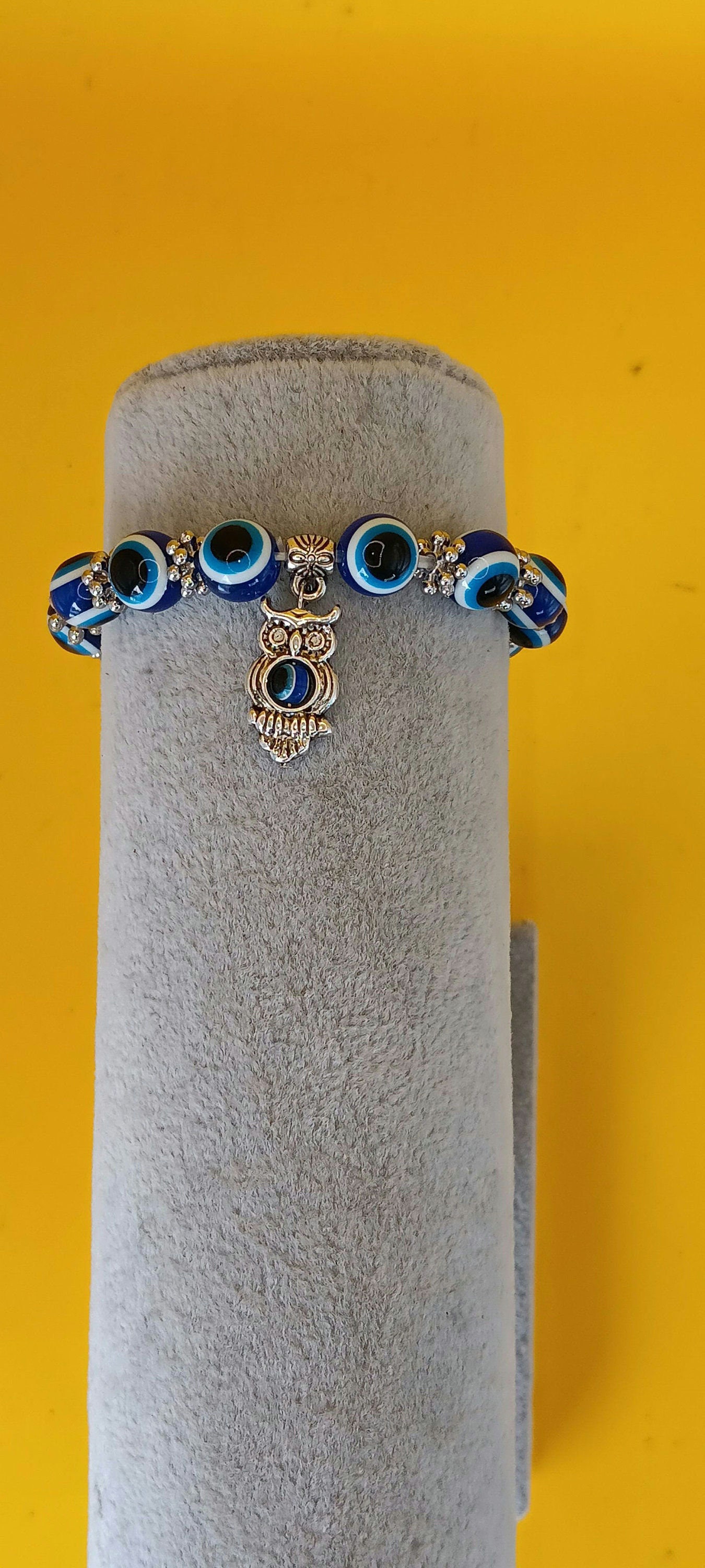 Owl with  tigers eyes bracelet.