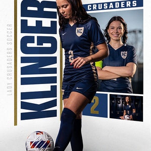 May include: A female soccer player in a blue and gold uniform with the number 2 on the front, juggling a soccer ball. The player is standing in a corner of a room with a white wall and a gold and blue banner that says "LADY CRUSADERS SOCCER" and "KLINGER" in large letters. The banner also has the word "CRUSADERS" in gold letters.