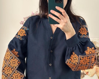 Vibrant Ukrainian Embroidered Linen Blouse - Handcrafted Folk Pattern. Dark blue linen with orange pattern
