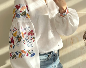 Ukrainian white linen blouse with traditional pattern. Ukrainian cultural embroidery. Folk embroidered garment. Natural superb fabric