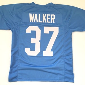 May include: A light blue football jersey with the name "WALKER" and the number "37" printed on the back in white.