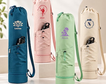 May include: Four cylindrical yoga mat bags in blue, pink, light green, and cream. Each bag features a drawstring top, an adjustable shoulder strap, a zippered front pocket with a black water bottle, and a bottom compartment with a zipper.