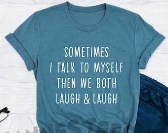 May include: A teal blue t-shirt with the text "SOMETIMES I TALK TO MYSELF THEN WE BOTH LAUGH & LAUGH" in white.