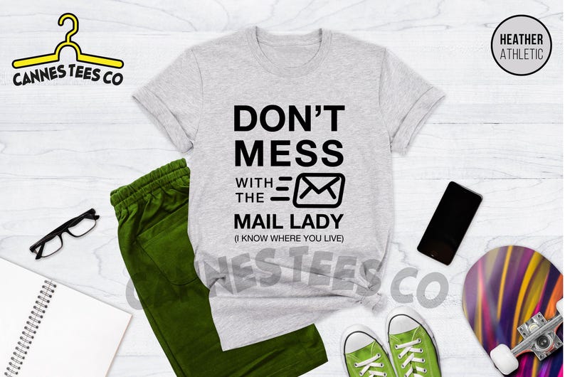 May include: Heather grey t-shirt with black text that reads "Don't Mess With The Mail Lady (I Know Where You Live)" and a black envelope graphic.