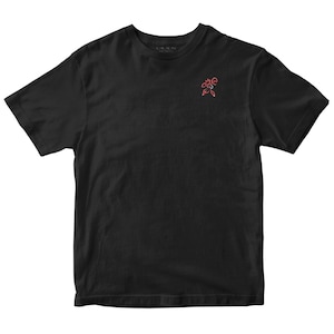 May include: Black short-sleeved t-shirt with a small red and white embroidered design on the upper left chest. The shirt has a crew neck and a classic fit. The brand name is printed on the upper back.