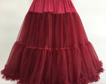 May include: A burgundy tulle petticoat with multiple layers and a ruffled hem.