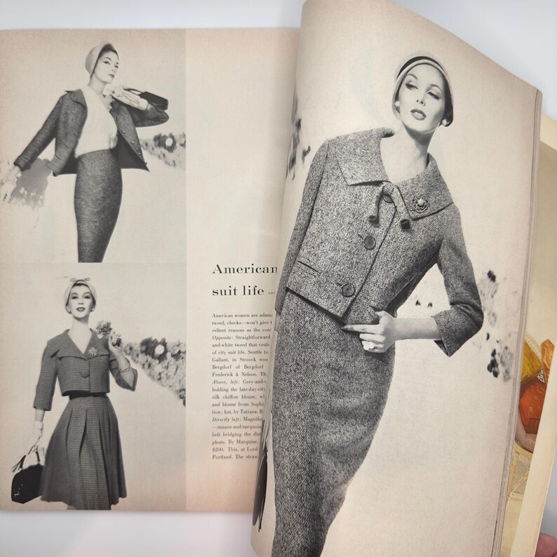 May include: A black and white magazine spread featuring a model wearing a grey suit with a matching hat. The text "American suit life..." is visible on the page.