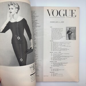 May include: A black and white photo of a woman wearing a black dress and white gloves. The photo is from a 1959 issue of Vogue magazine. The magazine cover features the text "Vogue" and "February 1, 1959".