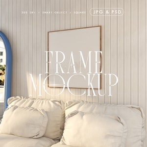 May include: A white wooden wall with a framed picture mockup above a white bed with two pillows. The text "FRAME MOCKUP" is written in white letters below the picture.
