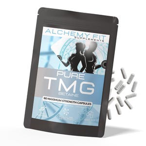 May include: Black pouch of Alchemy Fit Pure TMG Betaine supplements. The pouch features the text "PURE TMG" and "60 MAXIMUM STRENGTH CAPSULES". Several gray capsules are scattered around the pouch. The image includes a graphic of two people.