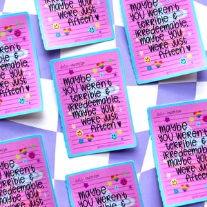 May include: Pink stickers with a blue border and the text "Maybe you weren't terrible & irredeemable, maybe you were just fifteen." The stickers are decorated with rainbows, stars, and smiley faces. The date 04/09/09 is also printed on the stickers.