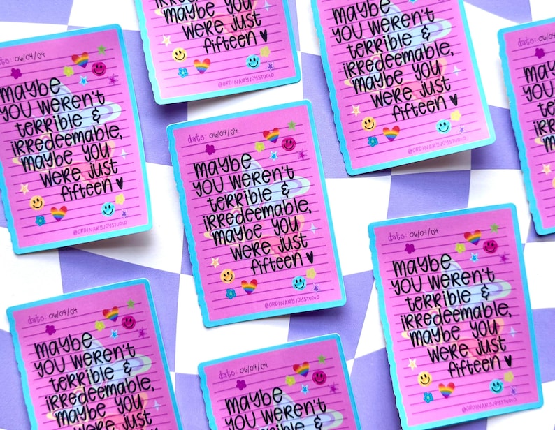 May include: Pink stickers with a blue border and the text "Maybe you weren't terrible & irredeemable, maybe you were just fifteen." The stickers are decorated with rainbows, stars, and smiley faces. The date 04/09/09 is also printed on the stickers.