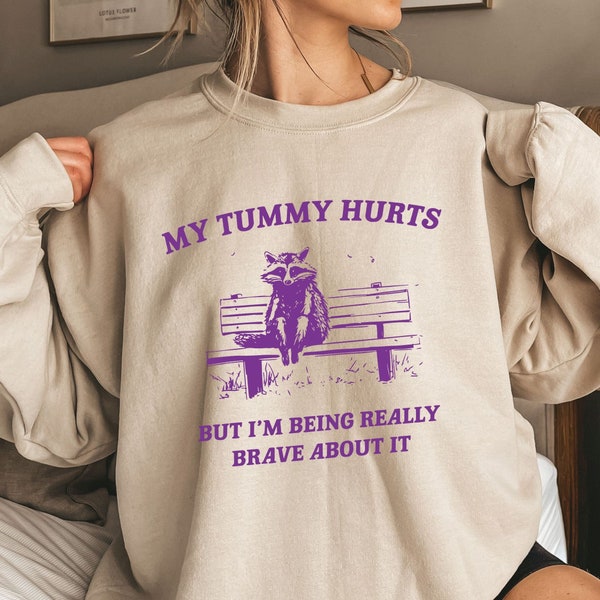 My Tummy Hurts but Im Being Really Brave About It Unisex Crewneck Sweatshirt and Hoodie - Funny Saying Graphic Shirt - Funny Racoon Crewneck