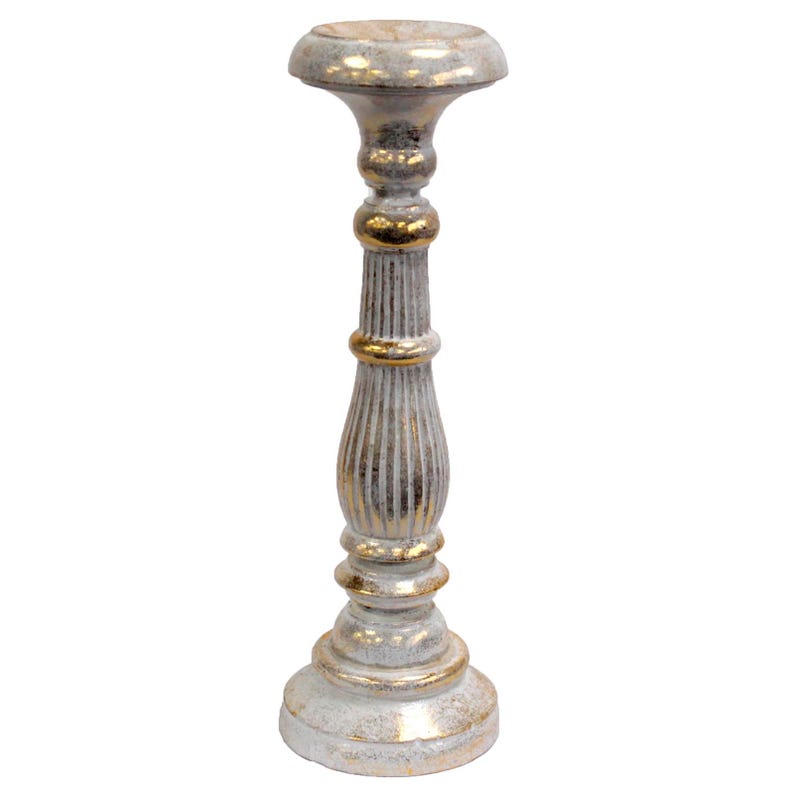 May include: A white and gold candle holder with a fluted column and a round base. The holder is made of wood and has a distressed finish.